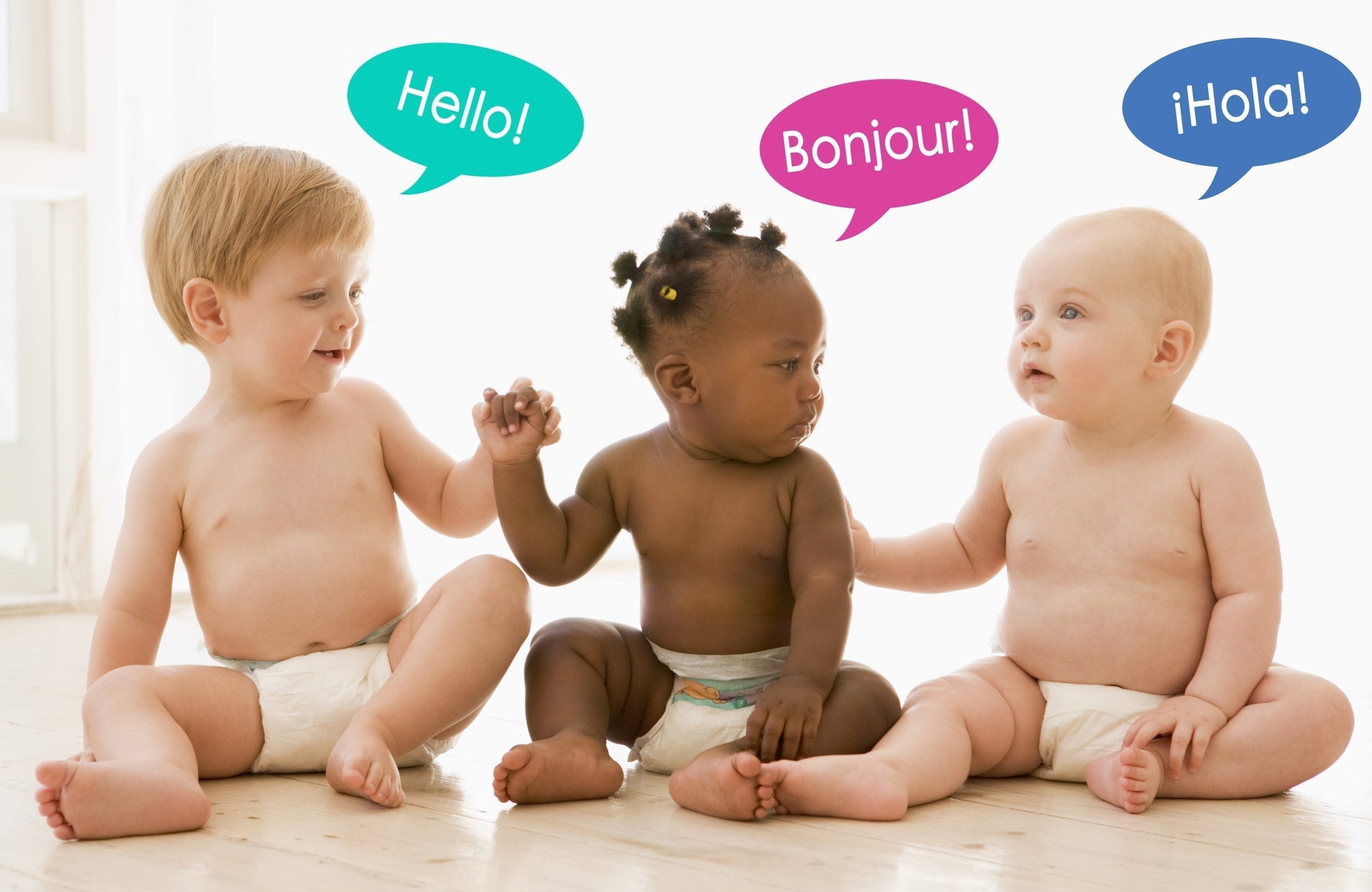 three multiracial babies with various language bubbles saying "hello"